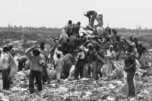 People going through trash at the Hulene dump in Maputo in 2014.