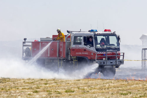 NSW firefighters extinguishing a small grass fire at Wagga Wagga Airport in 2014.