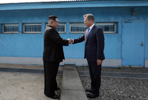 President Moon Jae-in greets Kim Jong-un, the leader of North Korea, at the border between the two countries.