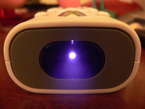 TV remote, showing infrared LED lit up.