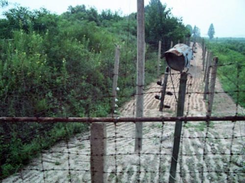 The countries are protected from each other by barbed wire and electric fences.