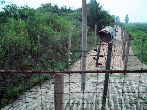 The countries are protected from each other by barbed wire and electric fences.