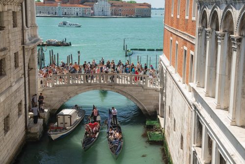Tourists crowd the bridges of Venice.