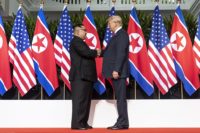 Mr. Kim and Mr. Trump shaking hands at the red carpet during the Singapore Summit.