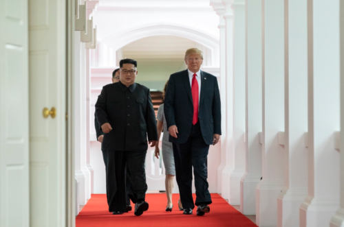 Kim and Trump walking to the summit room.