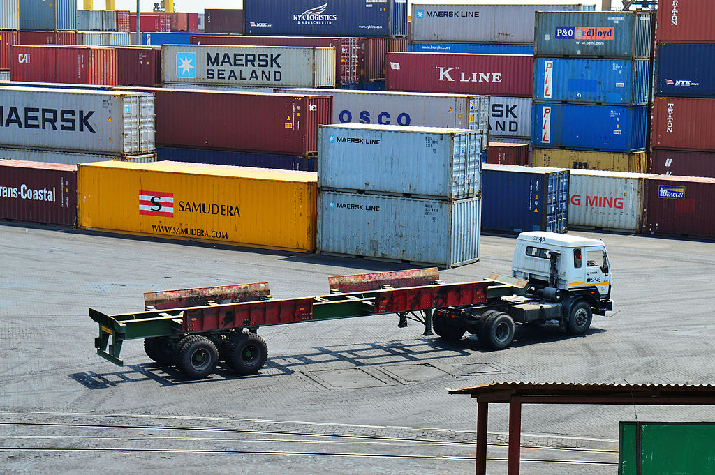 Containers can be easily stacked and then put on trucks or trains to travel on land.