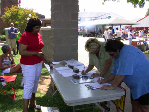 People collecting signatures.