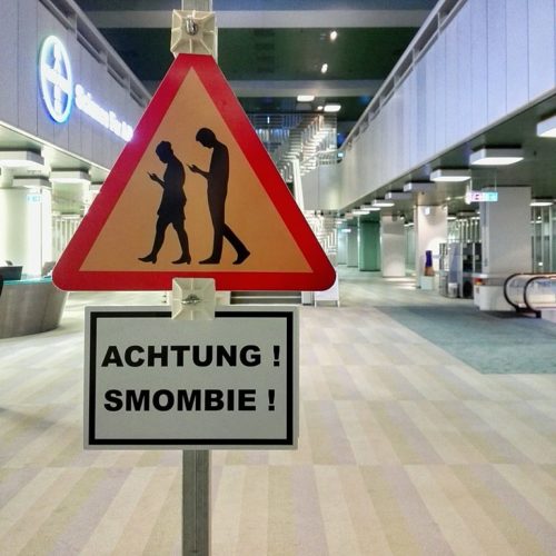 Achtung! Smombie! ("Caution! Smombie!") This sign in Germany warns people to look out for "smartphone zombies".