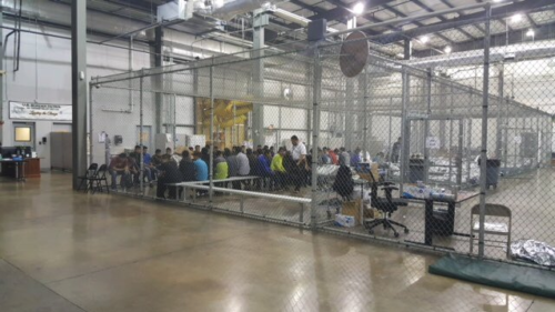 Government workers deal with immigrants in large buildings like this one in Texas.