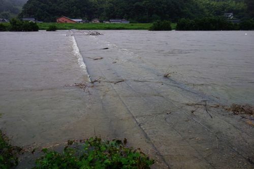 Flood waters cover a bridge in Japan.