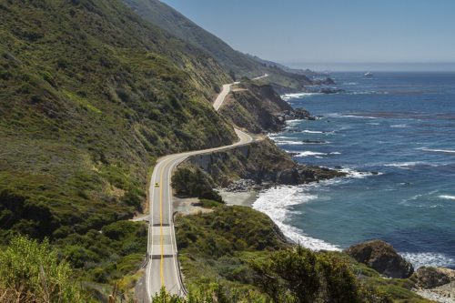 Highway 1 runs along cliffs above the ocean near Big Sur, California.