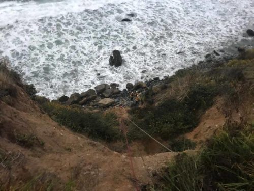 Rescue workers pulled Ms. Hernandez to the top of the cliff with ropes.