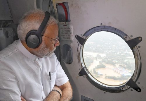 Prime Minister Narendra Modi views flooded area from the air.