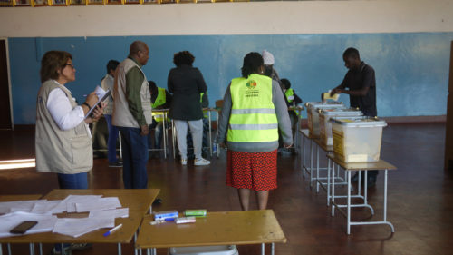 Observers at a polling station during Zimbabwe's 2018 election.