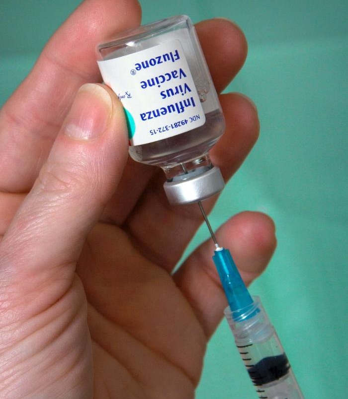 Syringe and vial of Influenza vaccine.