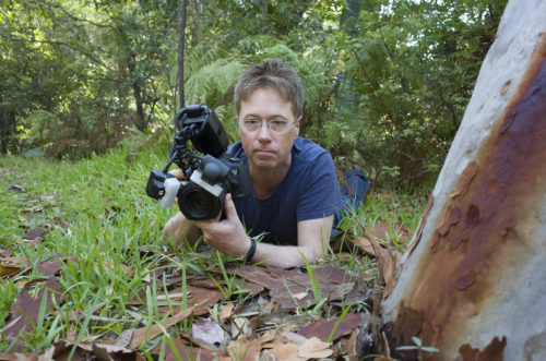 Jurgen Otto lying on the ground taking pictures.