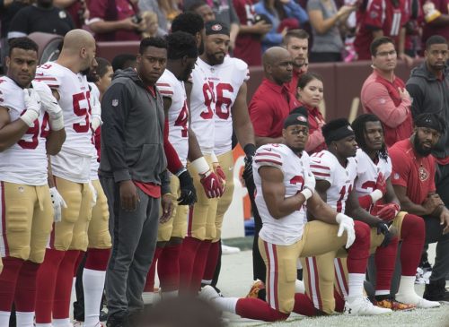 Some members of the San Francisco 49ers kneel during the National Anthem, 2017.