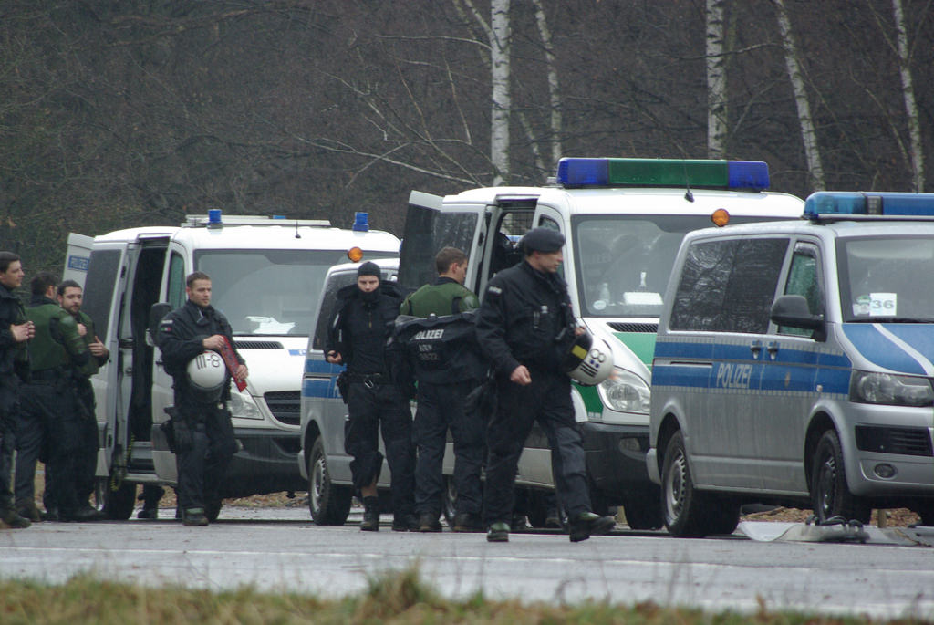 Police near vans outside Hambach Forest.