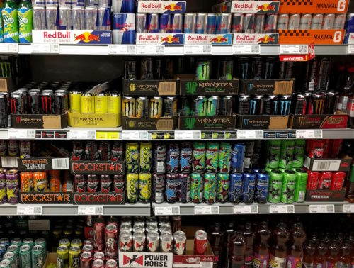 Energy drinks on supermarket shelves.