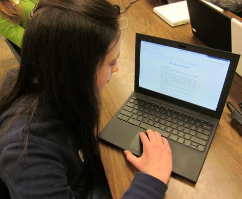 Student using Google apps on a Chromebook.