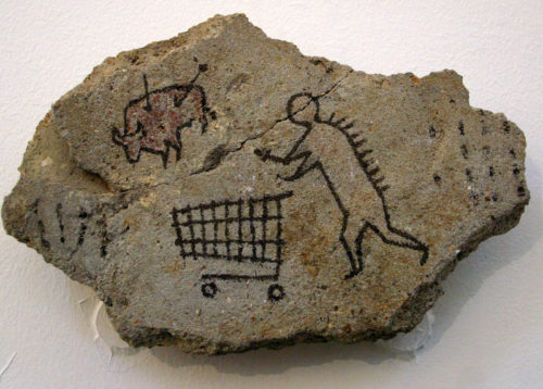 Banksy's fake cave painting of a early human with a shopping cart.