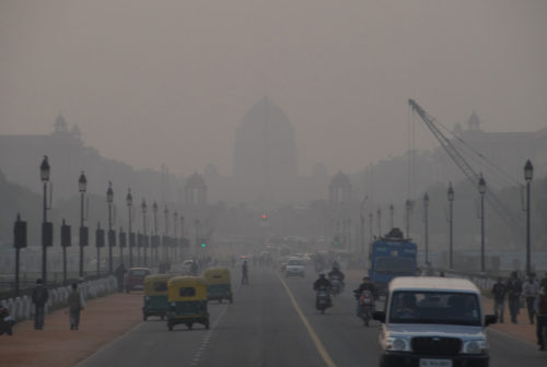 Smog in Delhi, looking down busy street