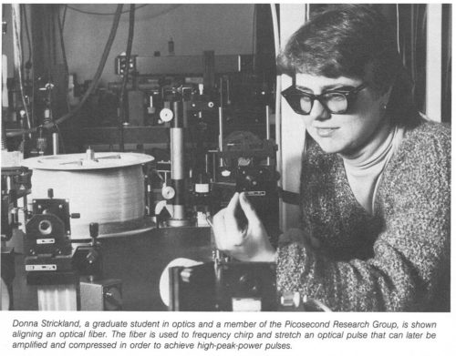 Donna Strickland, a graduate student in optics and a member of the Picosecond Research Group, is shown aligning an optical fiber. The fiber is used to frequency chirp and stretch an optical pulse that can later be amplified and compressed in order to achieve high-peak-power pulses.