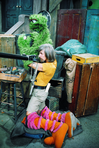 Caroll Spinney performing Oscar the Grouch while in his Big Bird legs (Courtesy of Sesame Workshop)