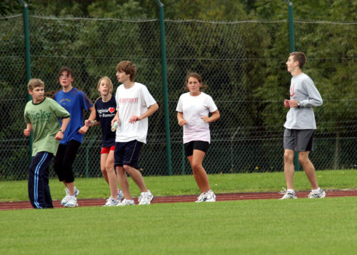 Teens running. Backwards running - one of our team building activities.