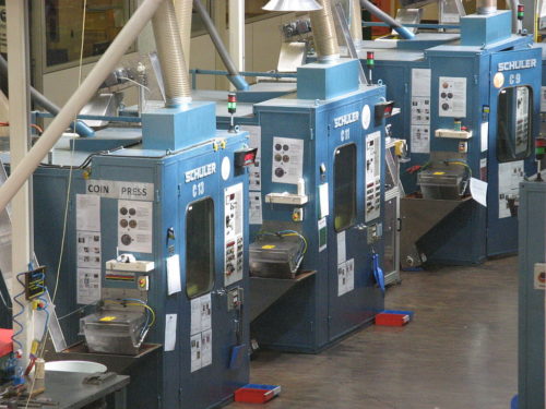 Three coining presses at the Royal Australian Mint, Canberra. These produce coins for general circulation.