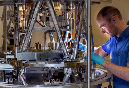 Scientist preparing the BIPM Kibble balance for a measurement