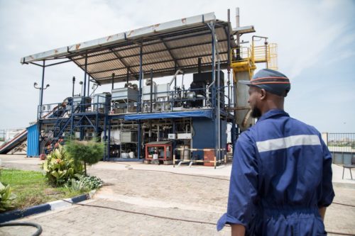 Technician Idrissa Coulibaly walks to the Janicki Omni Processor in Dakar, Senegal on September 25, 2018. Waste is transported to the Omni Processor in Dakar for treatment. The Omni Processor takes waste and turns it into drinking water, electricity, and ash.