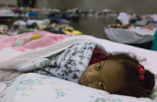 Houston, TX., 9/10/2005 -- Johnetra Kissach rests at the George R. Brown shelter in Houston, following being evacuated from New Orleans due to Hurricane Katrina. FEMA photo/Andrea Booher