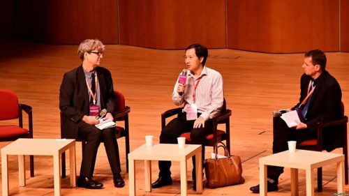 Chinese scientist He Jiankui (M) at his panel session with hosting panel members Robin Lovell-Badge (L) and Matthew Porteus (R) at the Second International Summit on Human Genome Editing in Hong Kong.