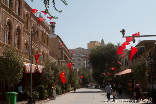 Kashgar street, flags and security cameras