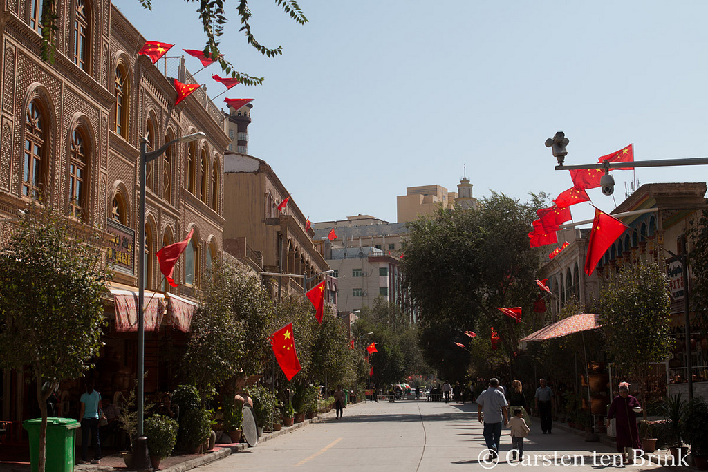 Kashgar street, flags and security cameras