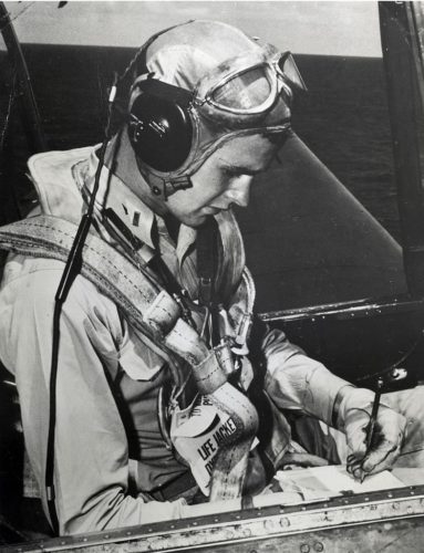 The later U.S. president George Herbert Walker Bush as a pilot, seated in a Grumman TBM Avenger aircraft.