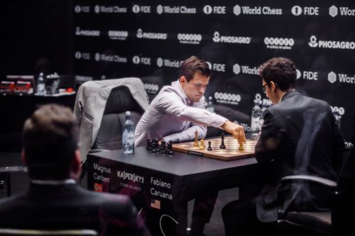 Magnus Carlsen (left) and Fabiano Caruana play a tie-breaking game in the world chess championships.