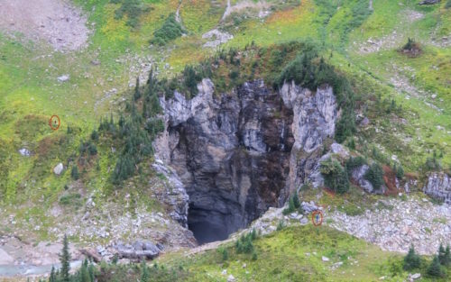 Mouth of Sarlacc's Pit from the air. Two small figures are visible on the edges, circled in red.