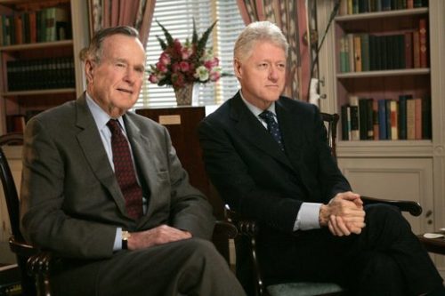 Former Presidents George H. W. Bush and Bill Clinton film a public service announcement.