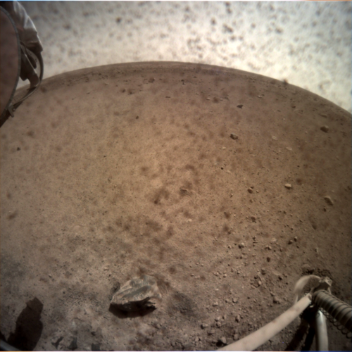 NASA's InSight Lander touched ground safely on Mars on Monday. This is a picture it sent back of the ground below it.