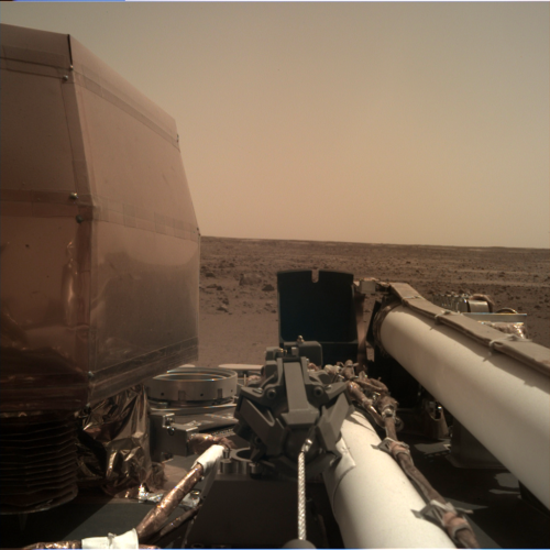 The InSight has unfolded its solar panels and is testing different parts of its system to make sure that there are no problems. This is another picture the InSight has sent back.