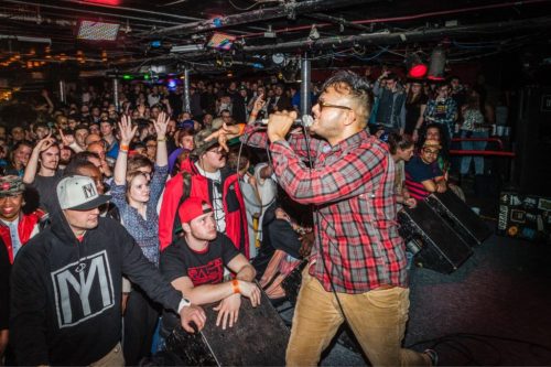 Raj Haldar rapping in front of a crowd.