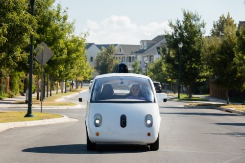 Smaller Waymo vehicle in a neighborhood.