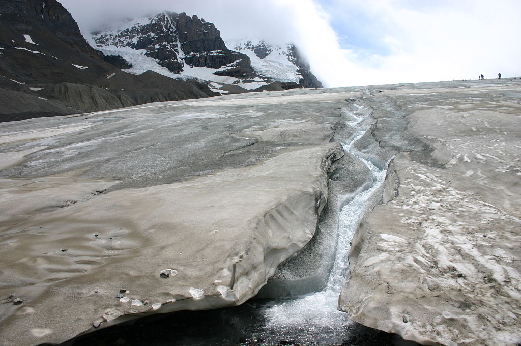 A river of melt-water running down the slope of a toe of the Athabasca Glacier. 4 July 2005