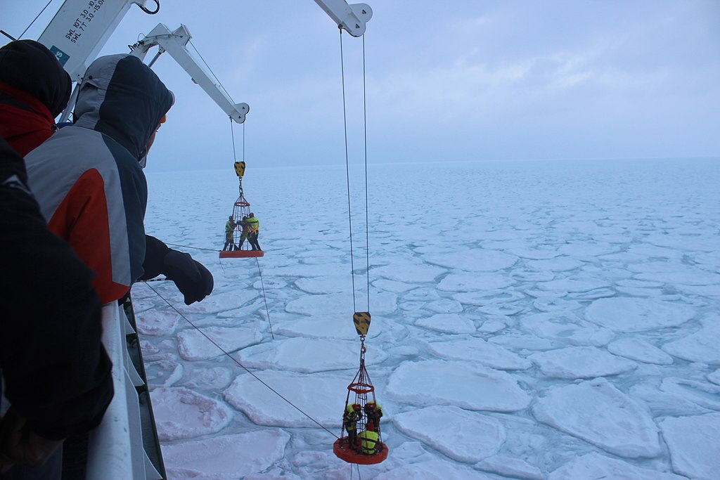 South African scientists work putting trackers on the ice in the Marginal Ice Zone of Antarctica on the Cape Agulhas II during a scientific cruise to the area in the winter of 2017