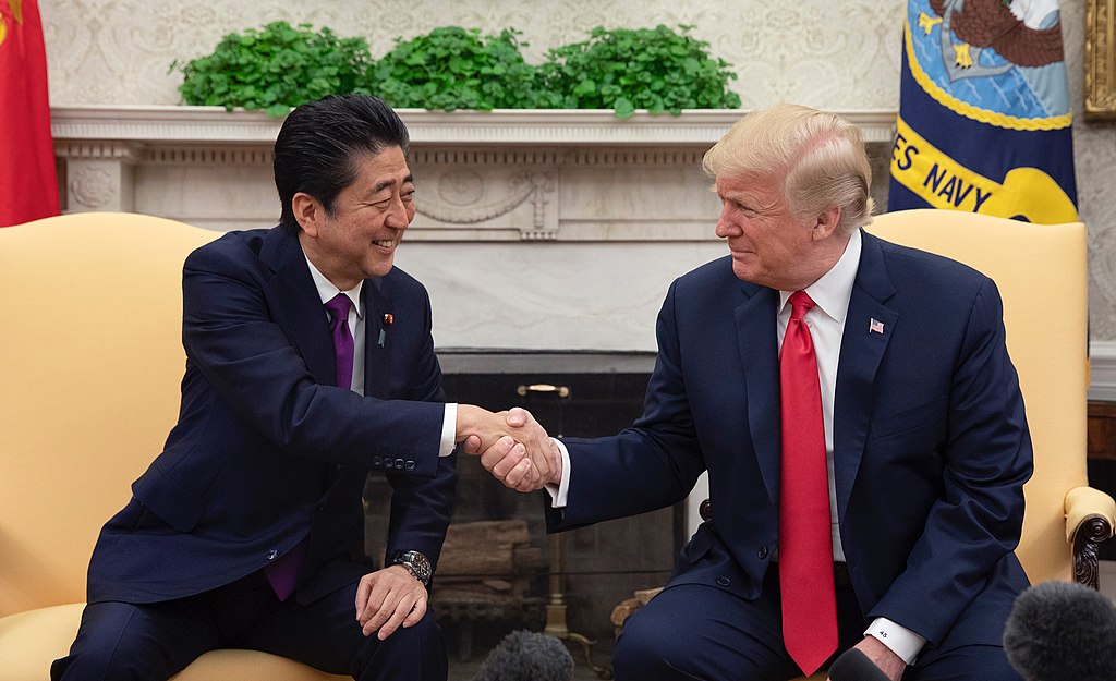Donald Trump shaking hands with Shinzō Abe in the Oval Office at the White House. June 7, 2018.