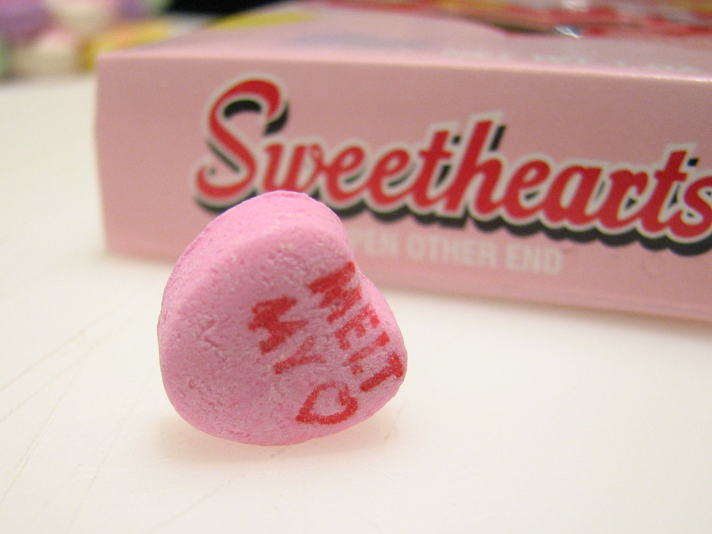 Sweetheart saying "Melt My Heart" in front of Sweethearts box.