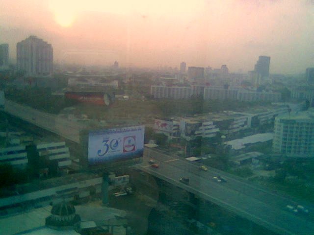 Bangkok pollution, shot through hotel window in the morning (if you can ignore the smog and the reflections).