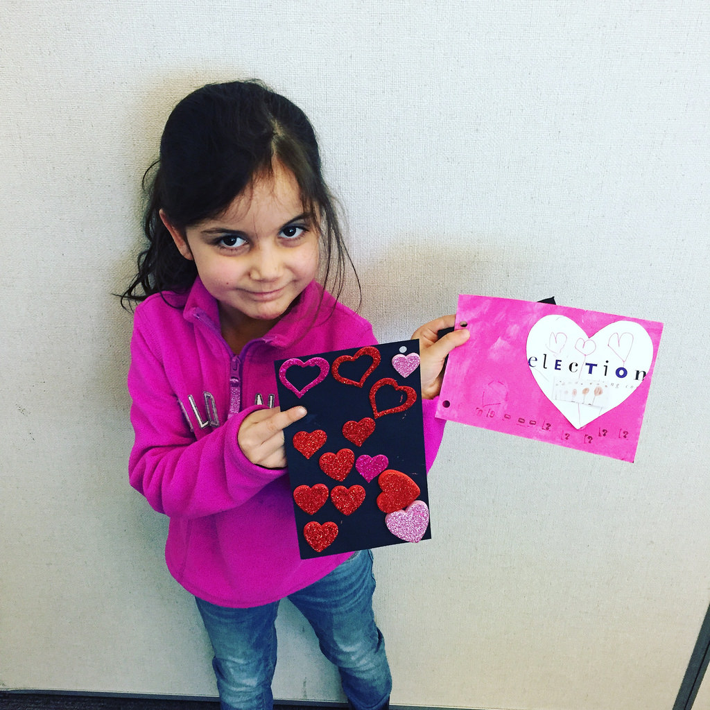 A young girl holds some handmade Valentine's cards made at the Vancouver City Library.